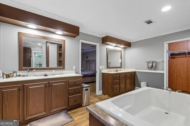 a large kitchen with a sink and cabinets