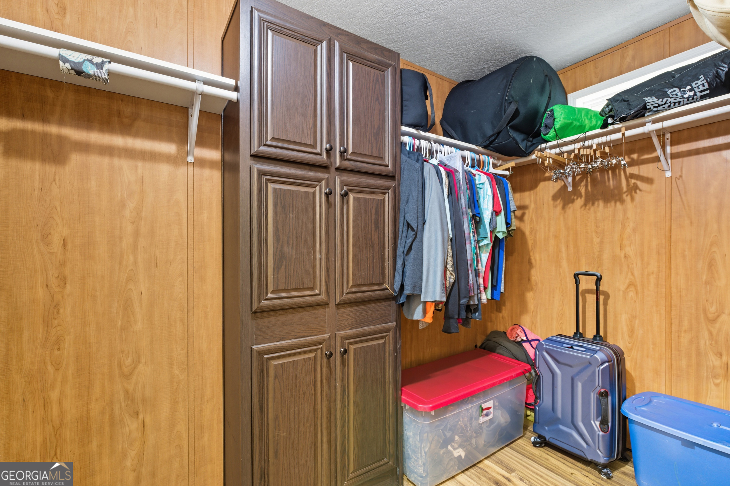 567 Cherokee Road Toccoa, GA 30577 - Photo 13 of 32 a view of walk in closet with clothes and shoes