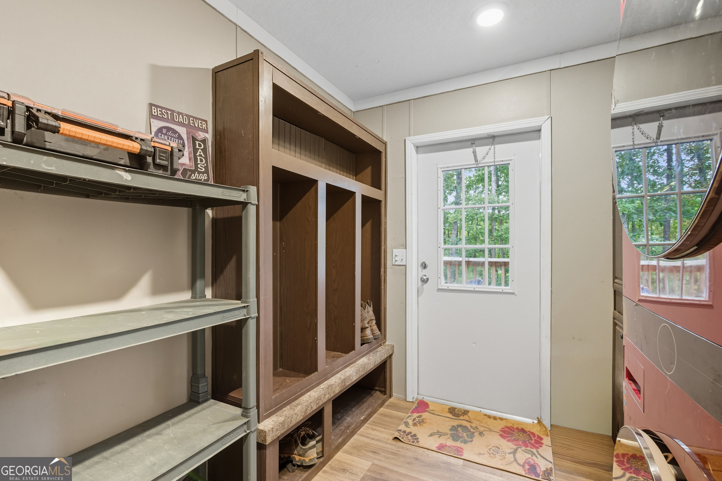567 Cherokee Road Toccoa, GA 30577 - Photo 22 of 32 a view of an empty room with wooden floor and a window