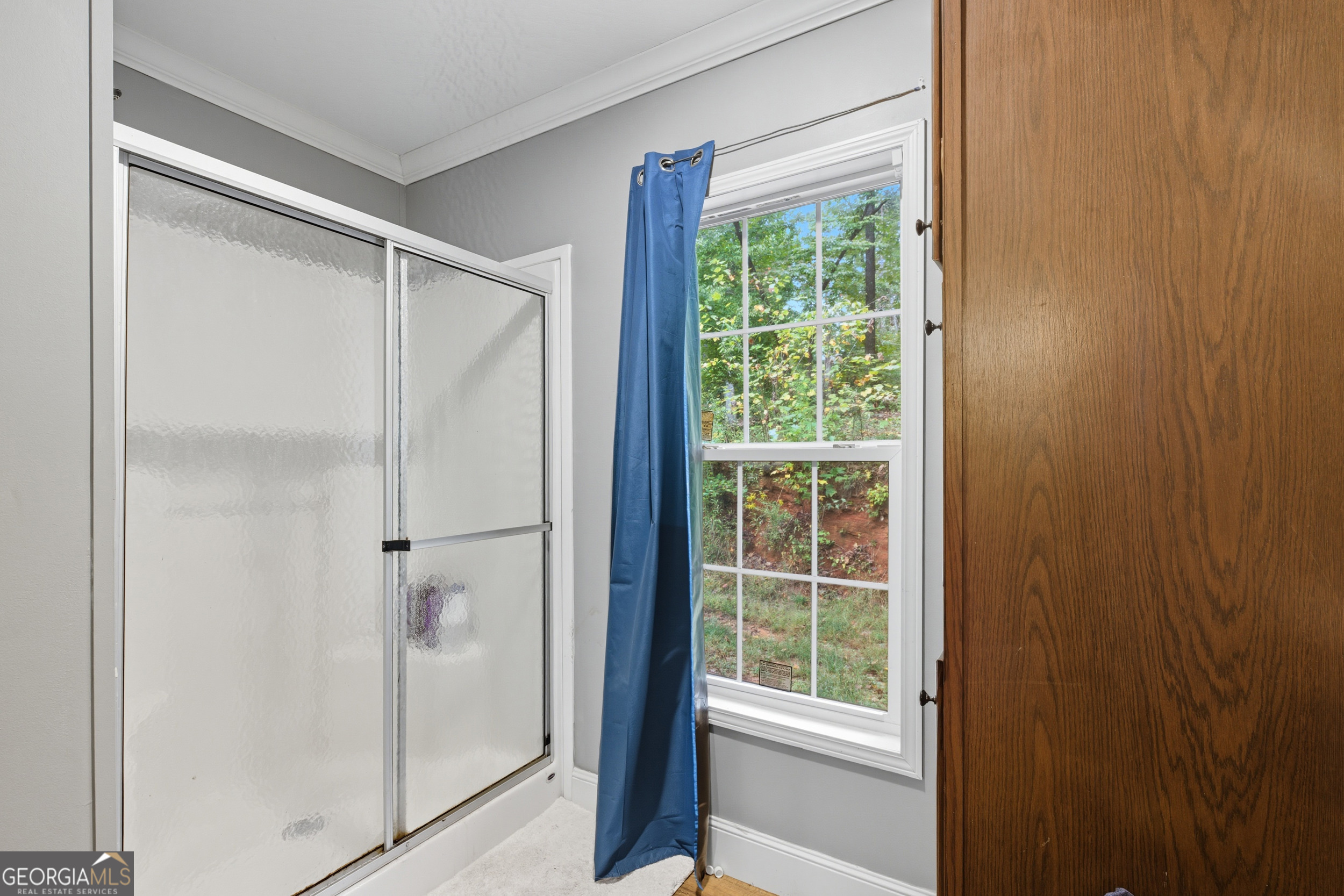 567 Cherokee Road Toccoa, GA 30577 - Photo 23 of 32 a bathroom with a glass shower door
