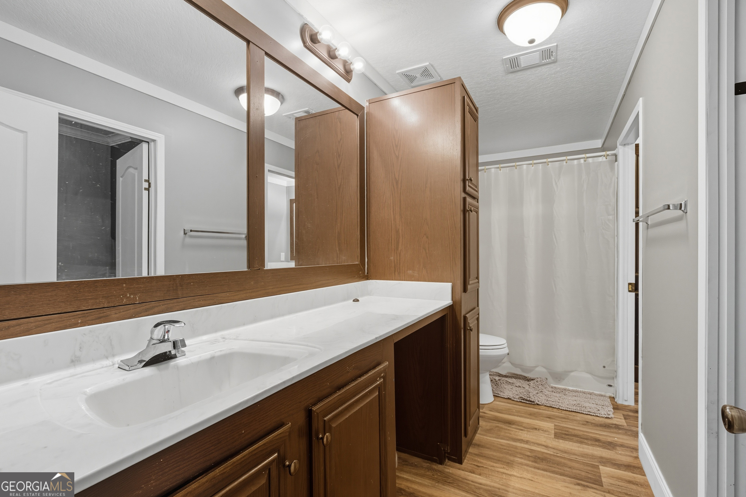 567 Cherokee Road Toccoa, GA 30577 - Photo 25 of 32 a bathroom with a double vanity sink and a mirror