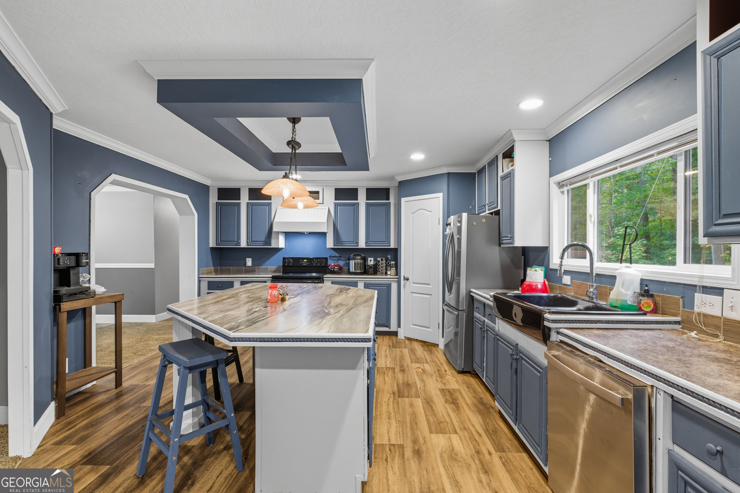 567 Cherokee Road Toccoa, GA 30577 - Photo 4 of 32 a kitchen that has a lot of cabinets a sink and appliances