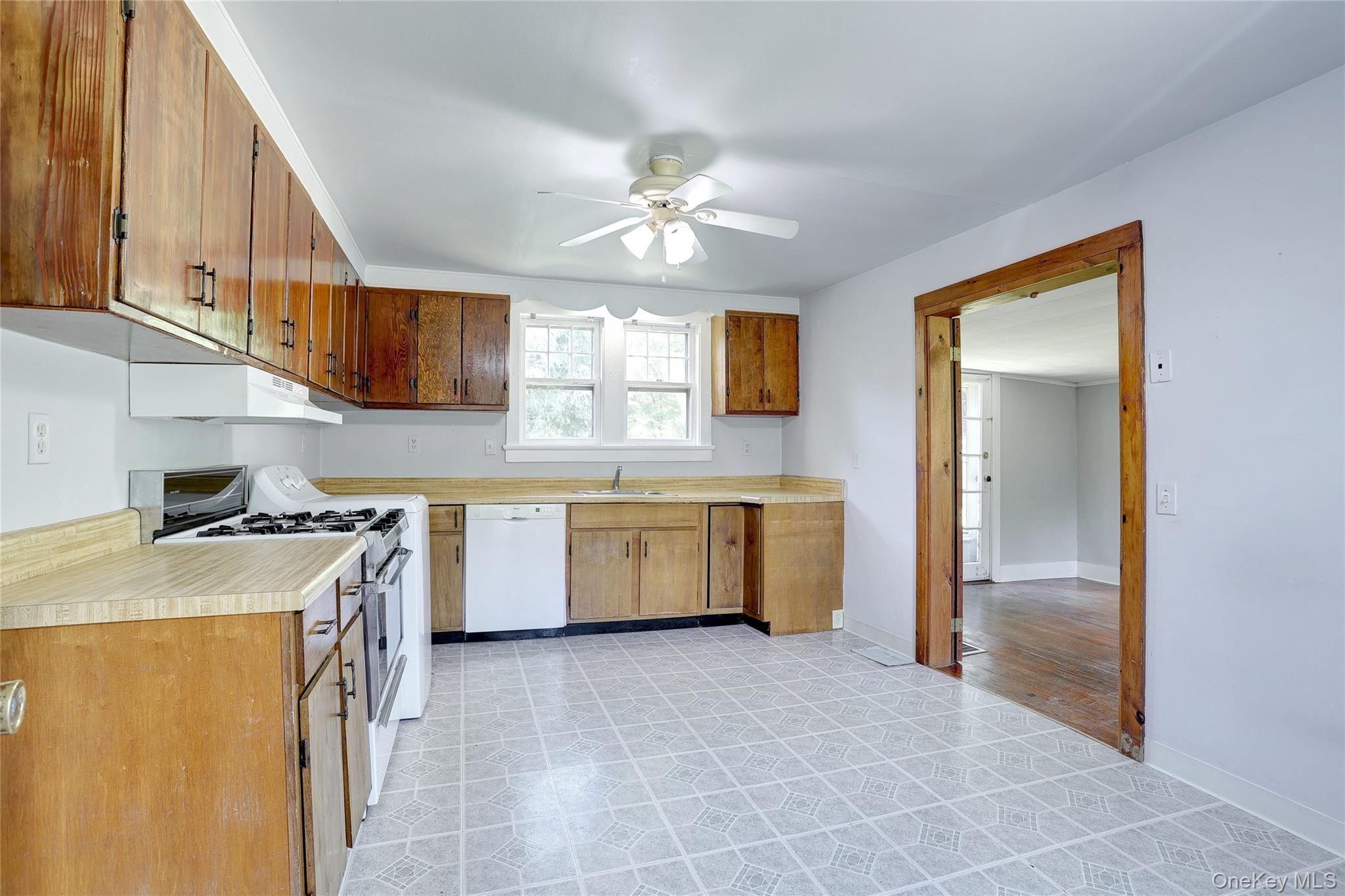 500 Haverstraw Road Suffern, NY 10901 - Photo 13 of 36 a kitchen with a stove a sink and a refrigerator