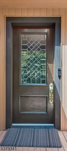 a view of a dining room with furniture wooden floor and chandelier