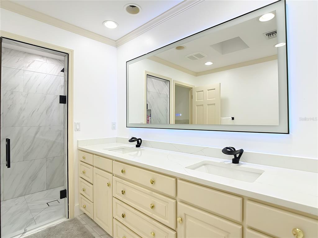 2130 Southwest 37th Street Road Ocala, FL 34471 - Photo 17 of 33 a bathroom with a sink and a mirror