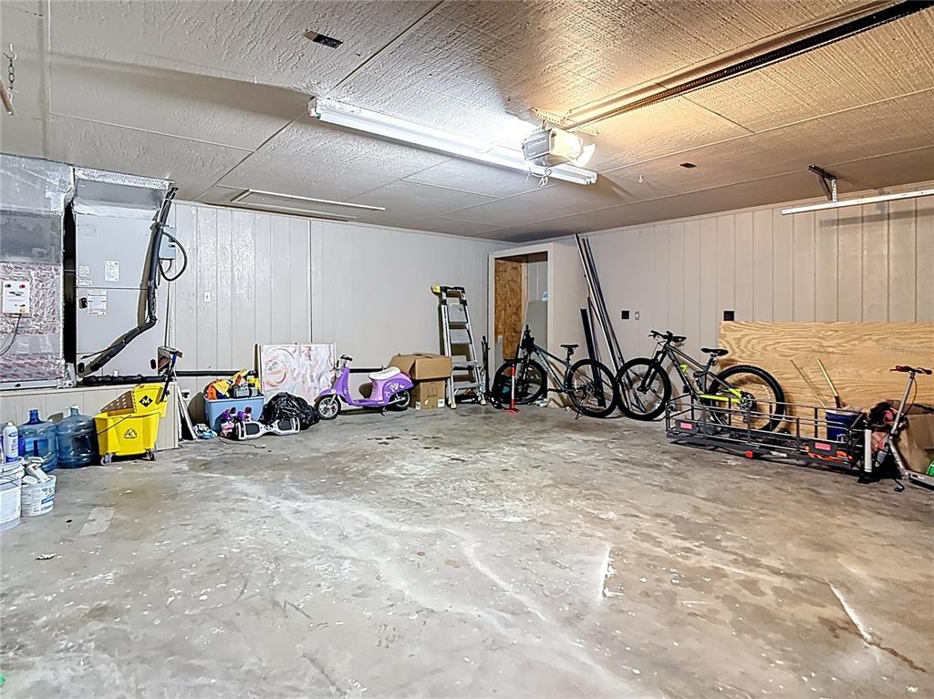 2130 Southwest 37th Street Road Ocala, FL 34471 - Photo 25 of 33 a view of a garage with a bike and car