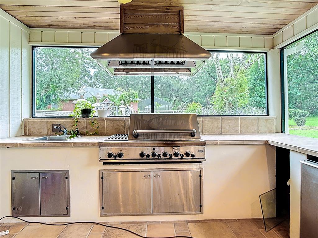 2130 Southwest 37th Street Road Ocala, FL 34471 - Photo 27 of 33 a kitchen with stainless steel appliances a stove and a window
