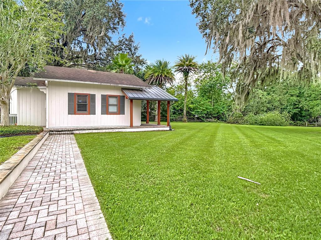 2130 Southwest 37th Street Road Ocala, FL 34471 - Photo 28 of 33 a front view of a house with yard