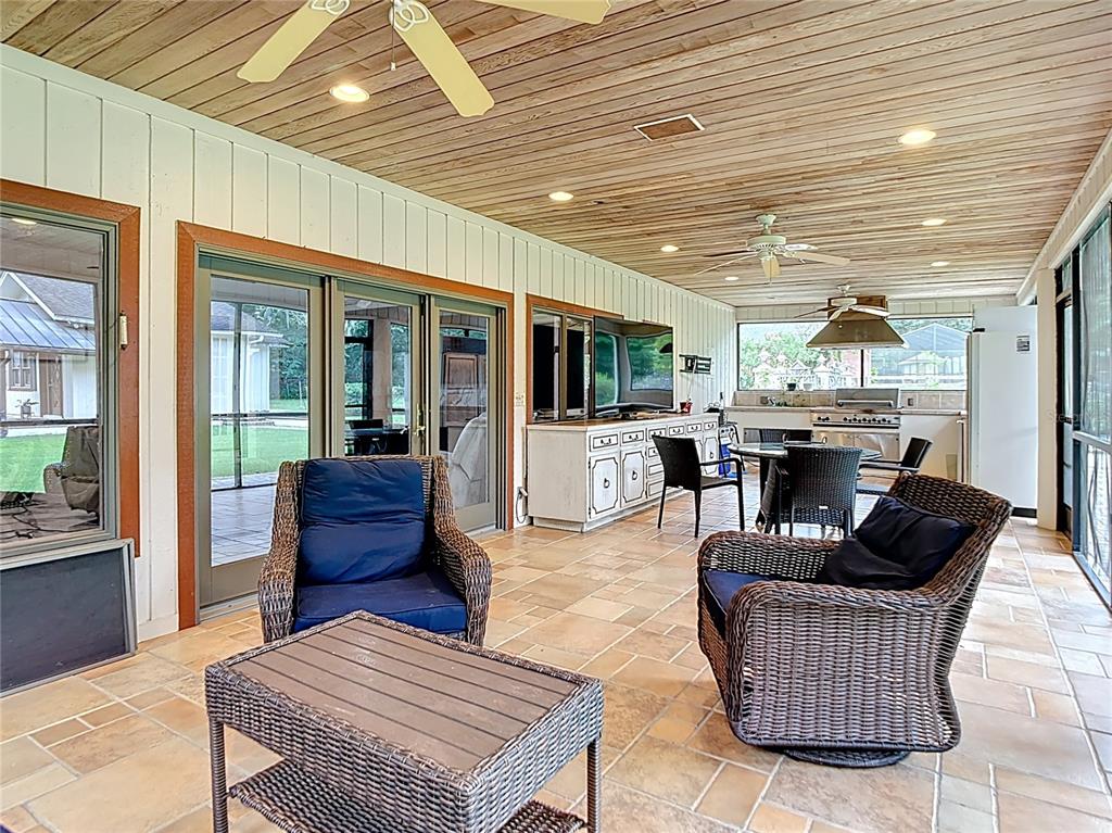 2130 Southwest 37th Street Road Ocala, FL 34471 - Photo 29 of 33 a living room with furniture ceiling fan and a rug