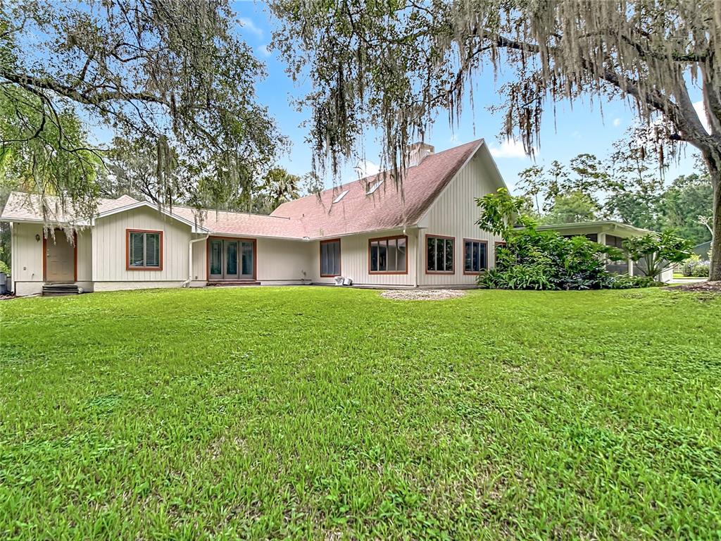 2130 Southwest 37th Street Road Ocala, FL 34471 - Photo 32 of 33 a house view with a garden space