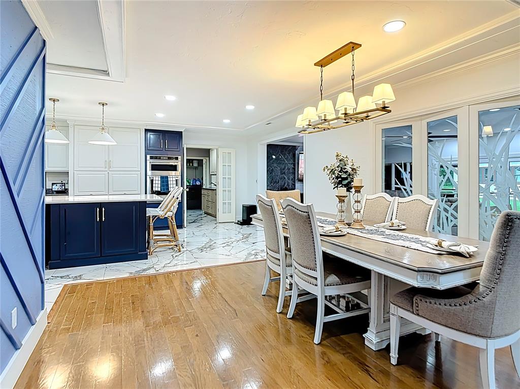2130 Southwest 37th Street Road Ocala, FL 34471 - Photo 7 of 33 a view of a dining room with furniture and a chandelier