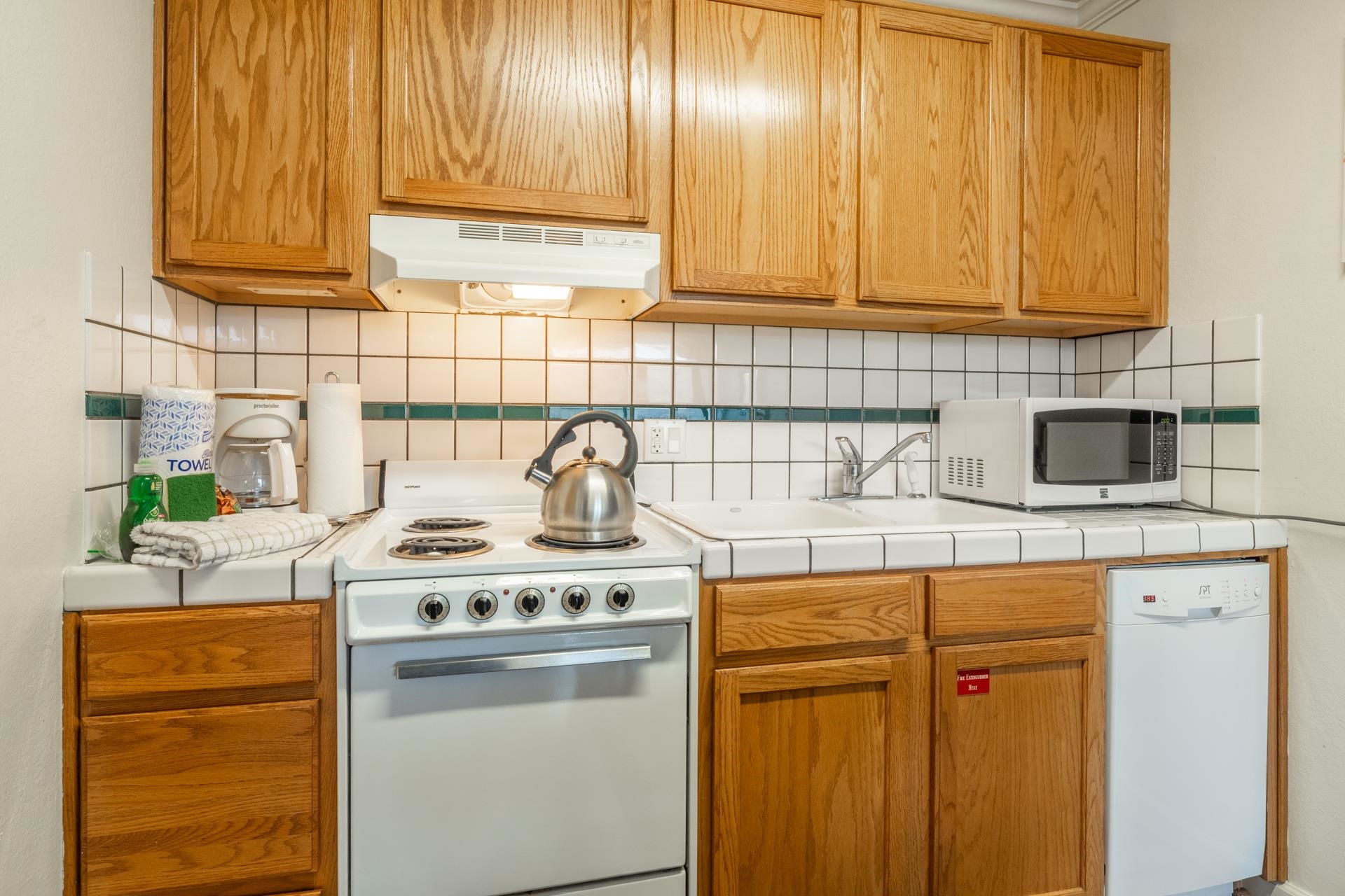 137 Laurel Mountain Road, Unit 312 Mammoth Lakes, CA 93546 - Photo 11 of 37 a kitchen with stainless steel appliances granite countertop a sink stove and refrigerator