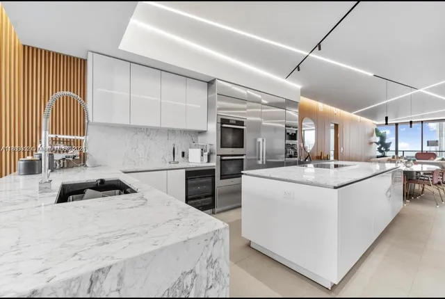 a view of a dining room with furniture and window