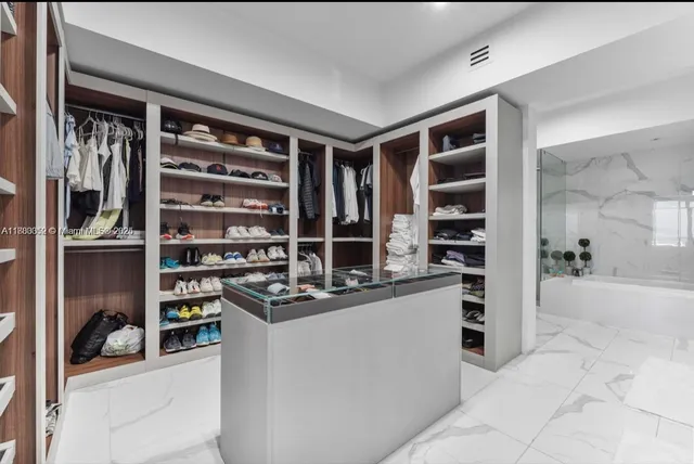 a bathroom with a sink toilet a mirror and shower