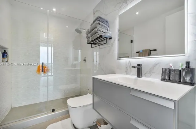 a bathroom with a sink a mirror and a bathtub