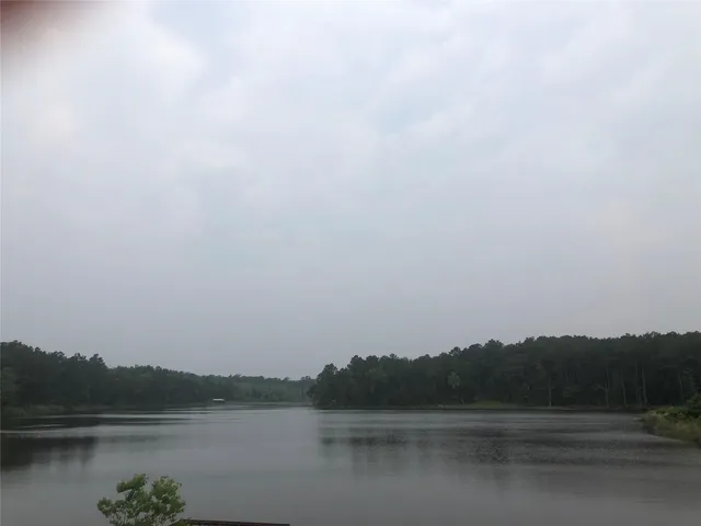 a view of lake with green space