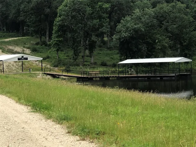 a view of lake with green space