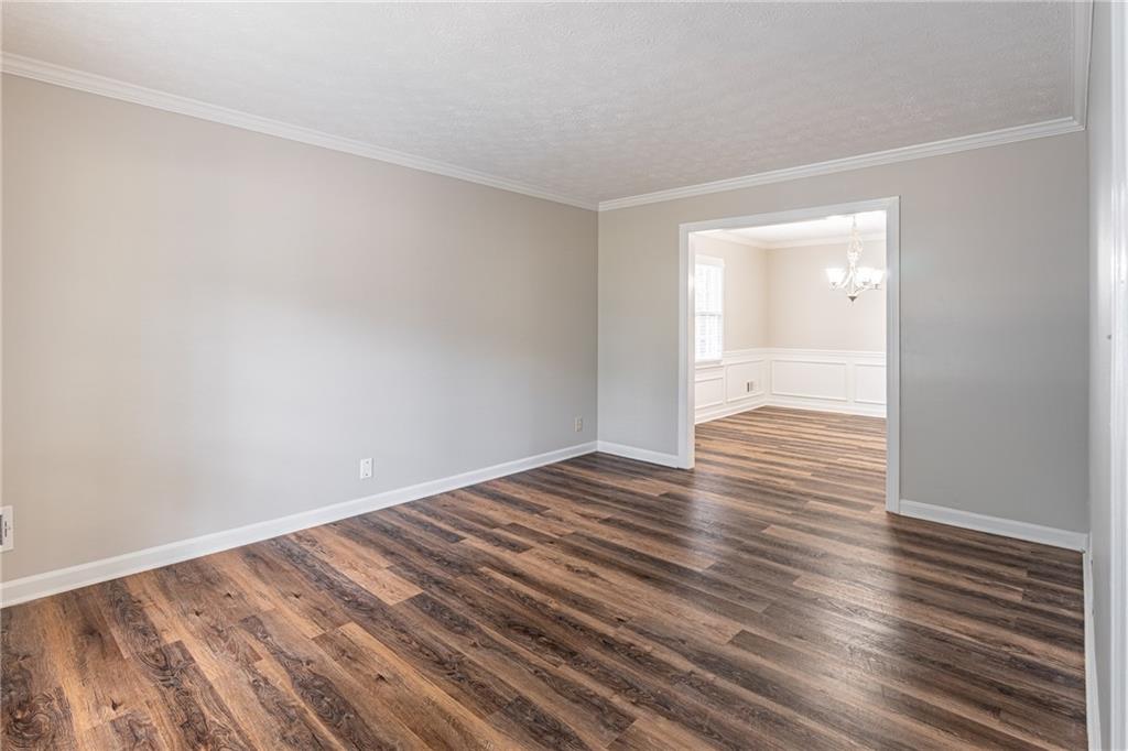 736 Singley Drive Lawrenceville, GA 30044 - Photo 11 of 33 a view of an empty room and wooden floor