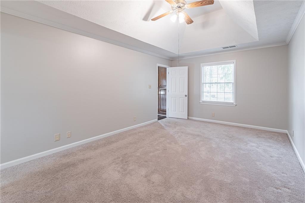 736 Singley Drive Lawrenceville, GA 30044 - Photo 14 of 33 an empty room with windows and fan