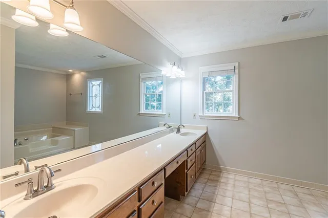a spacious bathroom with a sink and a bathtub