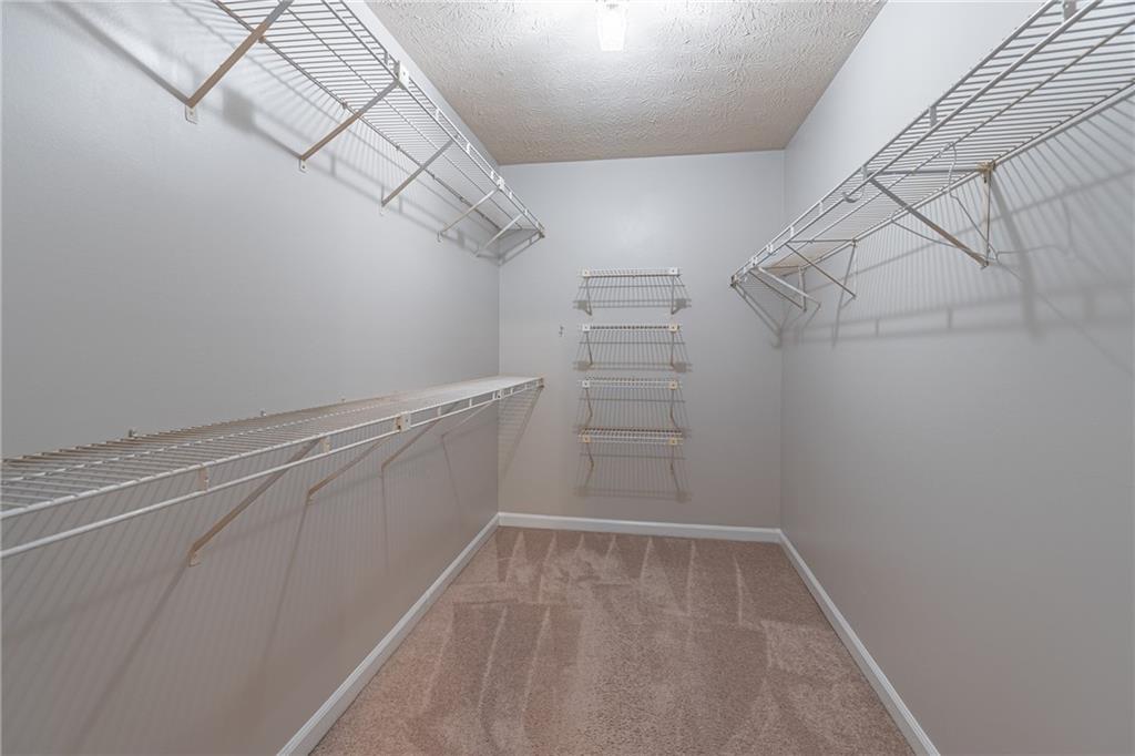 736 Singley Drive Lawrenceville, GA 30044 - Photo 17 of 33 a view of storage and utility room with racks on the wall