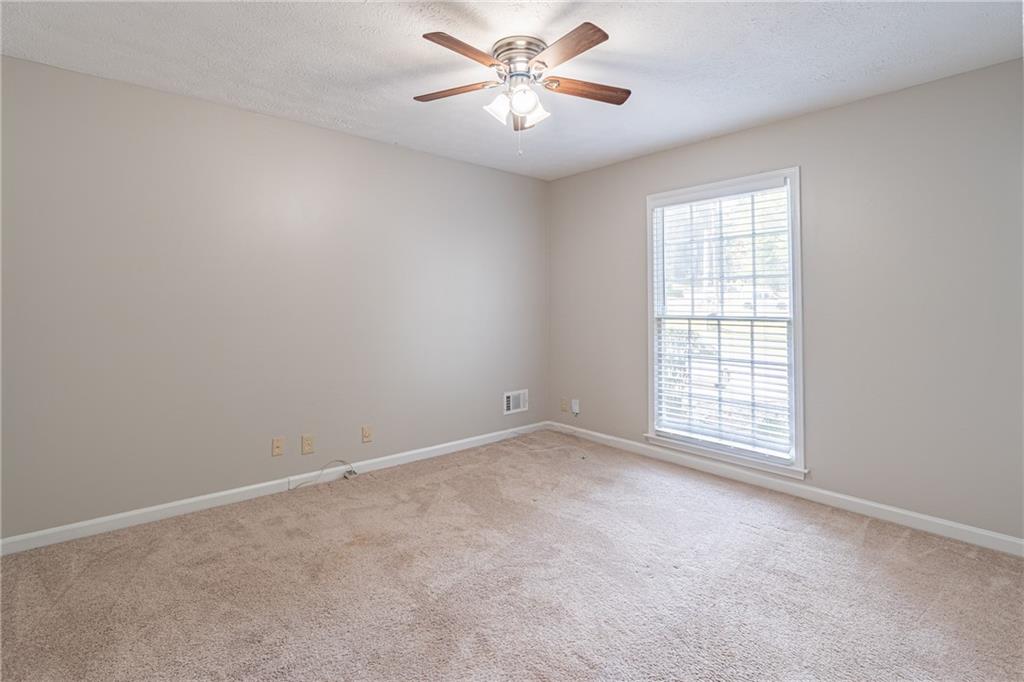 736 Singley Drive Lawrenceville, GA 30044 - Photo 18 of 33 a view of an empty room with a window