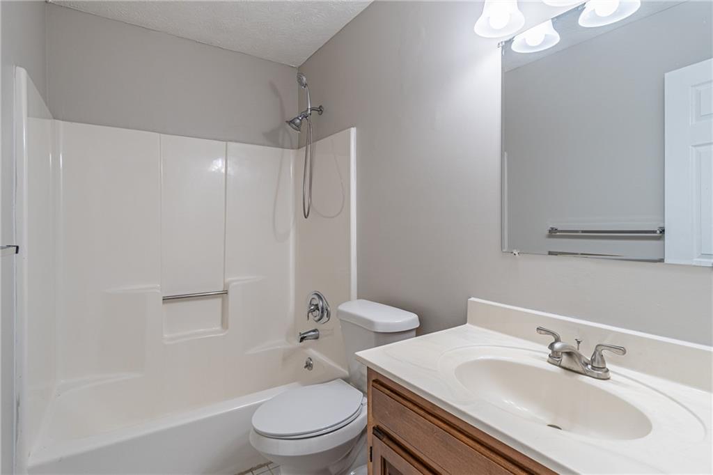 736 Singley Drive Lawrenceville, GA 30044 - Photo 23 of 33 a bathroom with a sink toilet vanity and shower