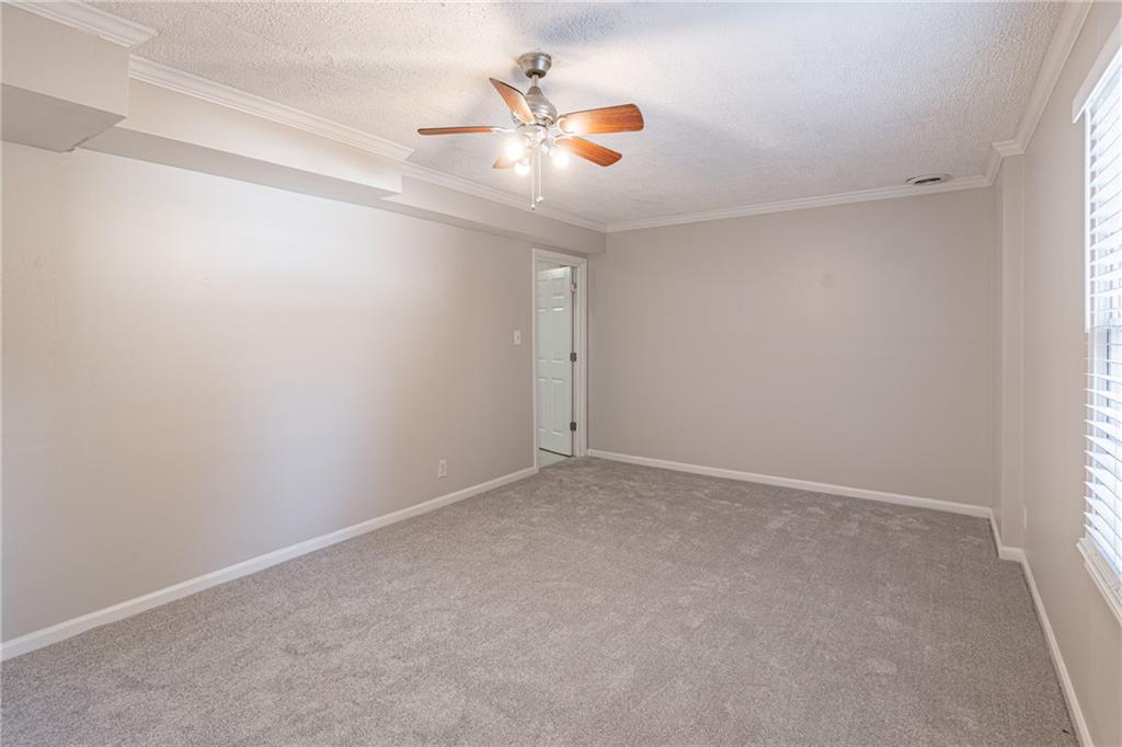 736 Singley Drive Lawrenceville, GA 30044 - Photo 25 of 33 an empty room with closet and ceiling fan