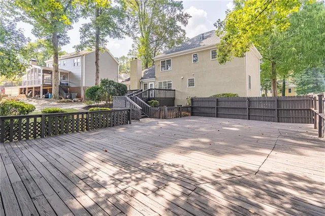 a view of a backyard with sitting area