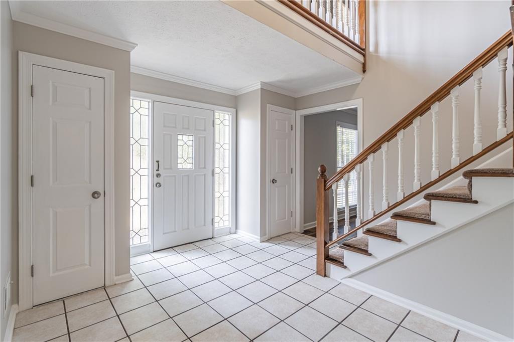 736 Singley Drive Lawrenceville, GA 30044 - Photo 3 of 33 a view of an entryway with staircase