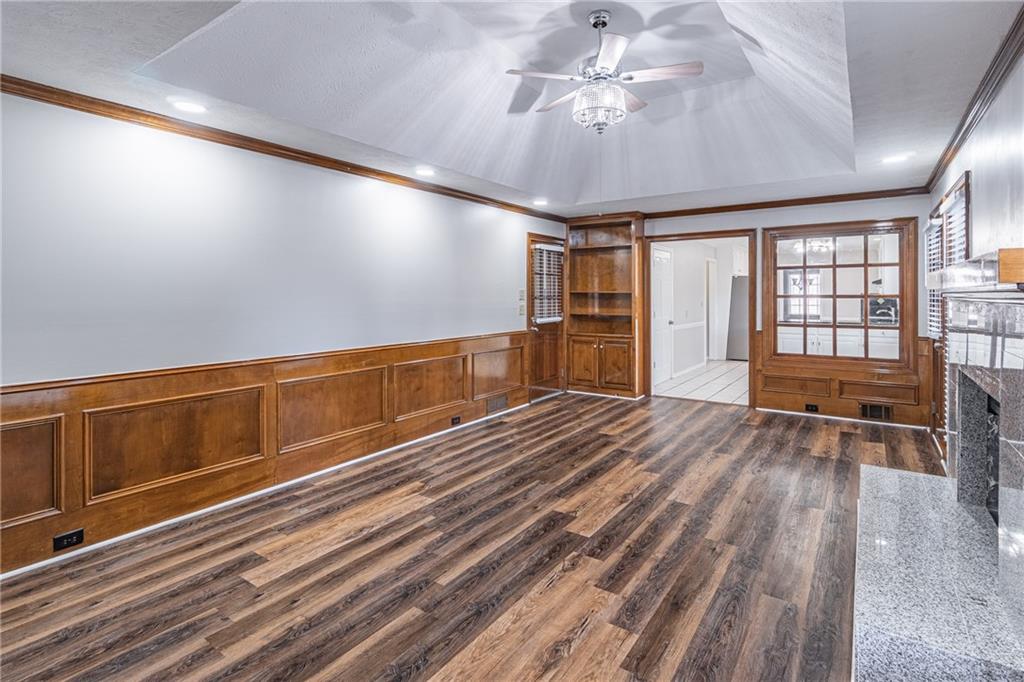 736 Singley Drive Lawrenceville, GA 30044 - Photo 6 of 33 a view of an empty room with a window and wooden floor