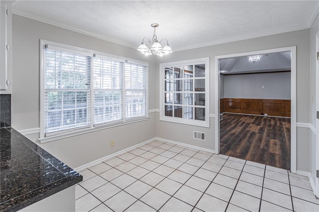 736 Singley Drive Lawrenceville, GA 30044 - Photo 9 of 33 a view of an empty room with a window
