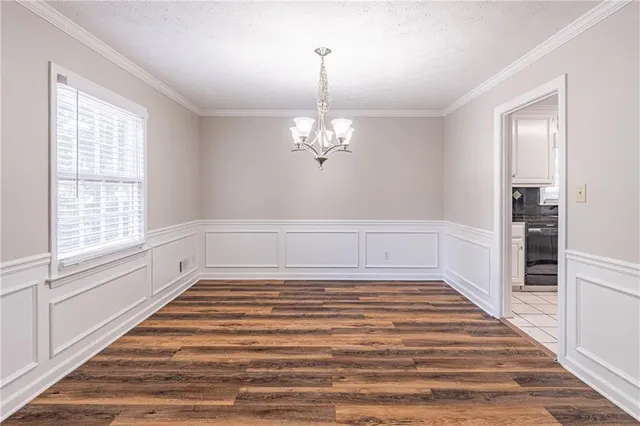 a view of a room with wooden floor and staircase