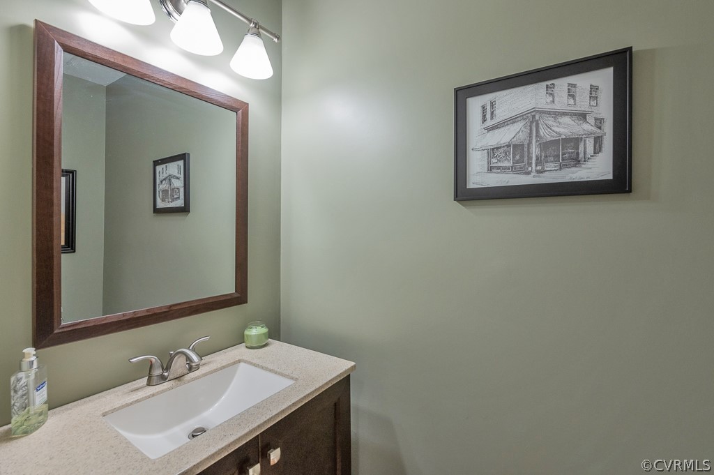 14202 Long Gate Road Midlothian, VA 23112 - Photo 11 of 27 a bathroom with a sink and a mirror