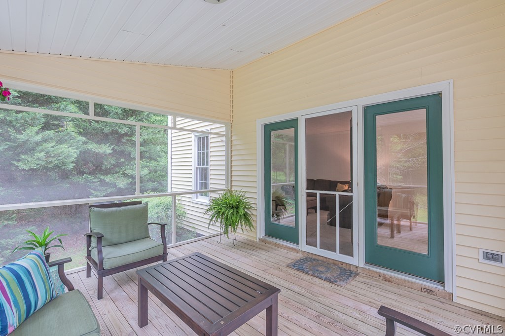 14202 Long Gate Road Midlothian, VA 23112 - Photo 24 of 27 a living room with furniture and a floor to ceiling window