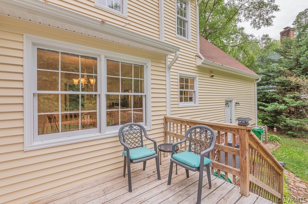 14202 Long Gate Road Midlothian, VA 23112 - Photo 26 of 27 a balcony with table and chairs