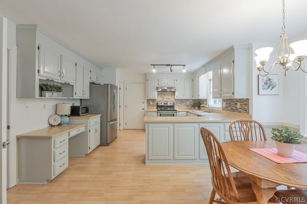 14202 Long Gate Road Midlothian, VA 23112 - Photo 5 of 27 a large kitchen with kitchen island a dining table and chairs