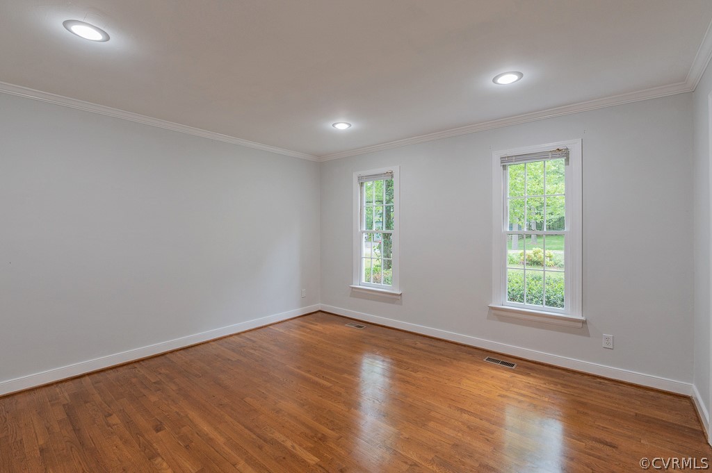 14202 Long Gate Road Midlothian, VA 23112 - Photo 9 of 27 an empty room with wooden floor and windows
