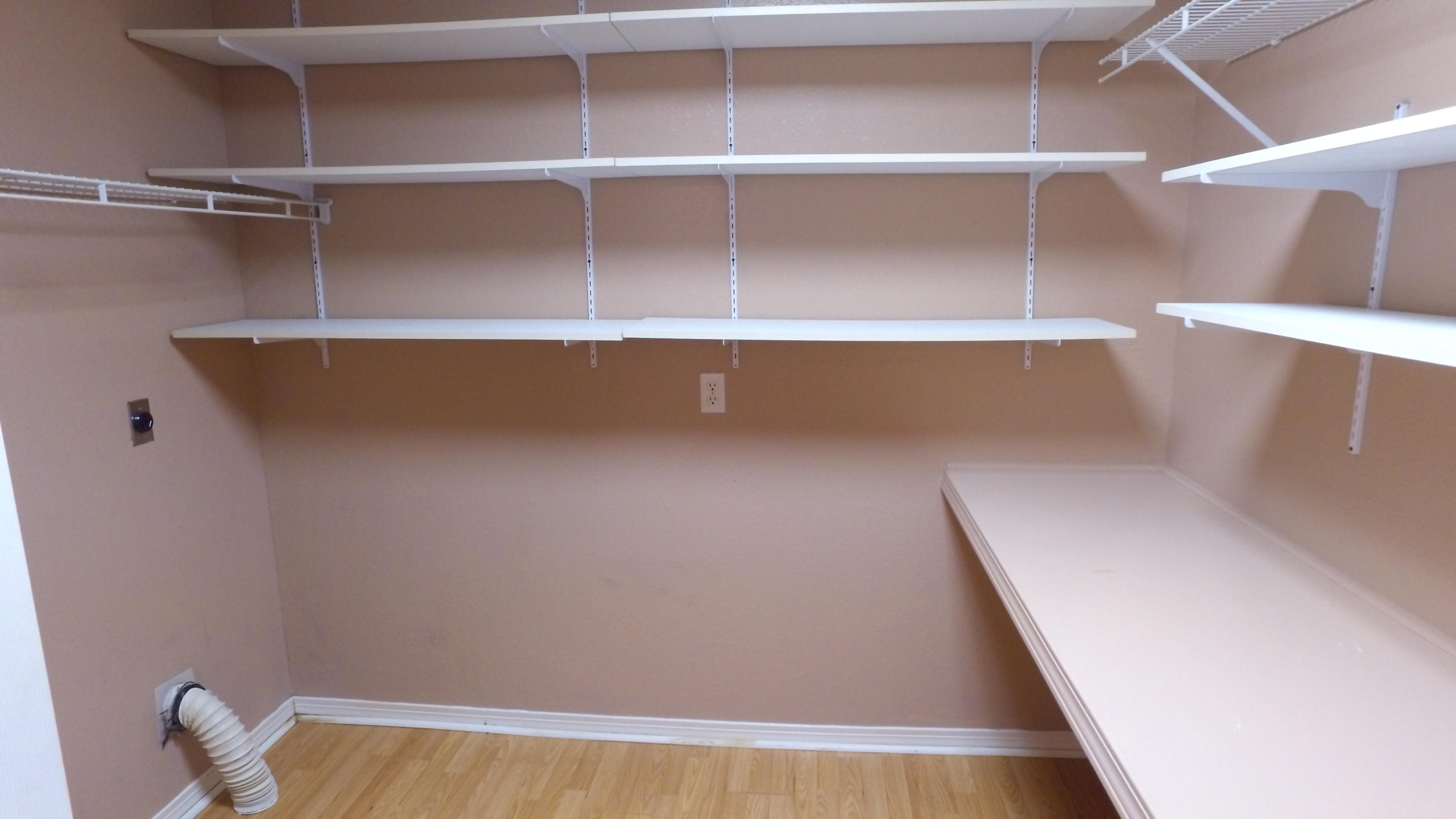 564 Ridge Lake Road Crestview, FL 32536 - Photo 13 of 58 a view of walk in closet with empty racks