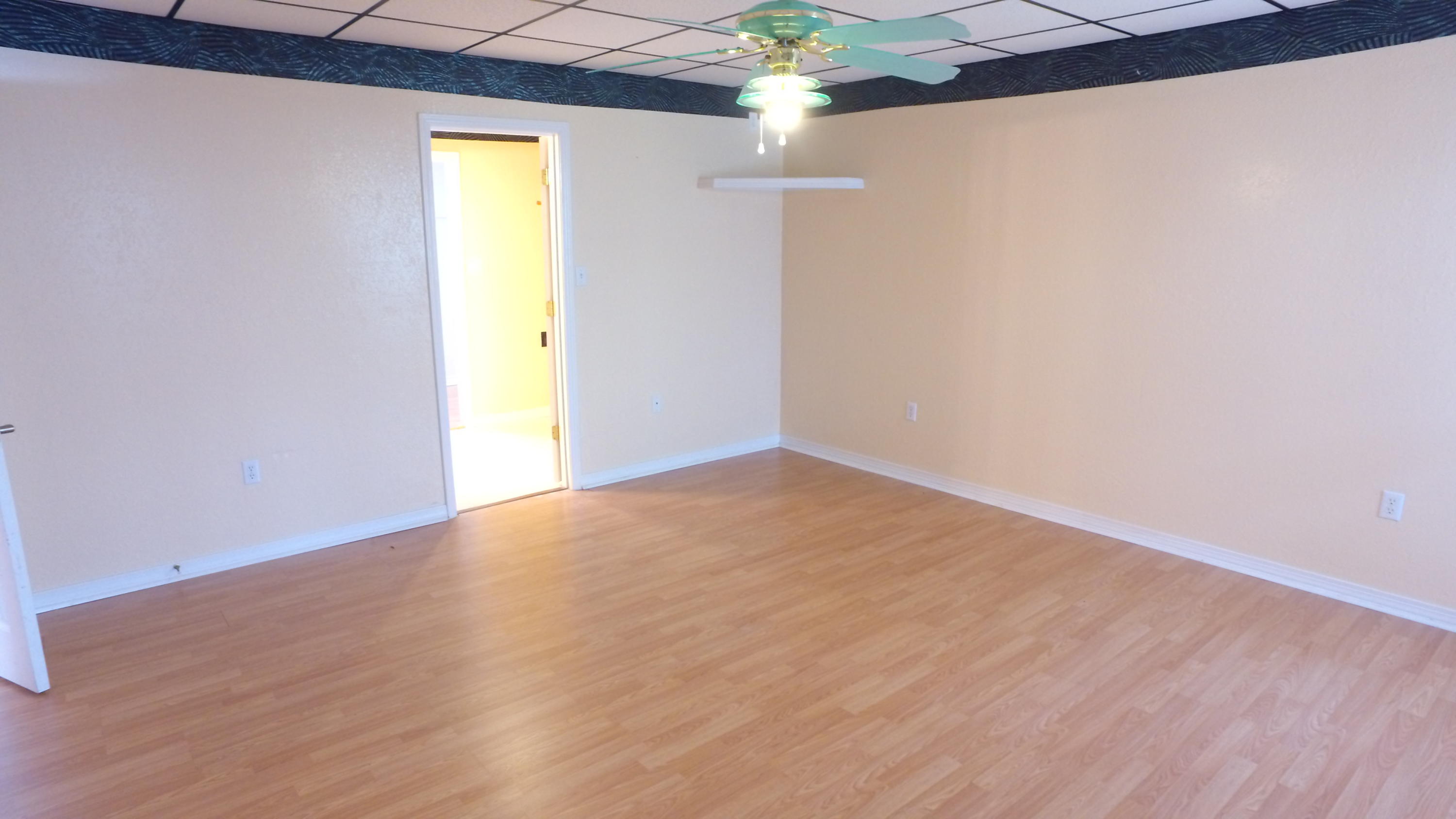 564 Ridge Lake Road Crestview, FL 32536 - Photo 18 of 58 a view of empty room with wooden floor