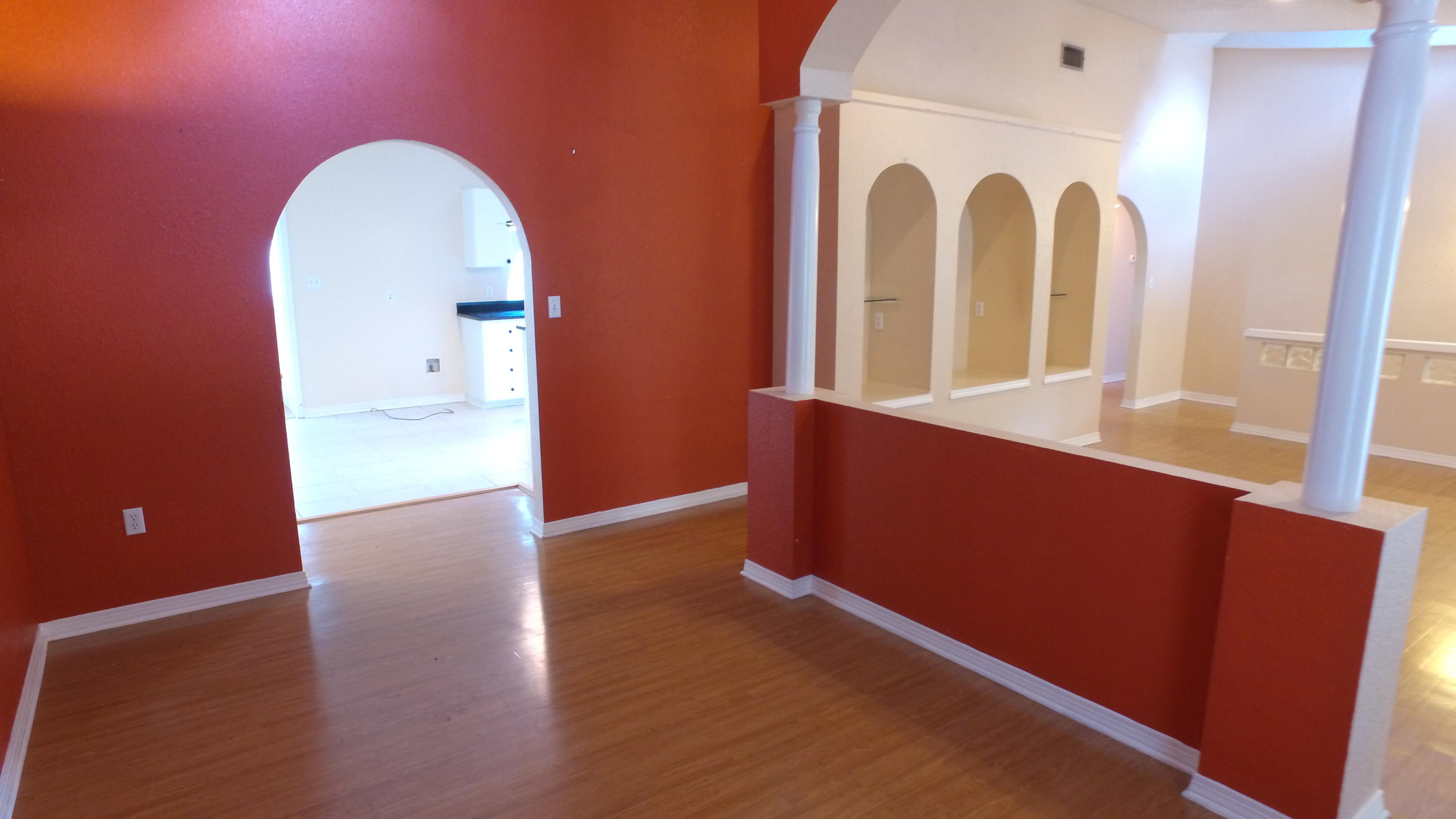 564 Ridge Lake Road Crestview, FL 32536 - Photo 27 of 58 an empty room with wooden floor and windows