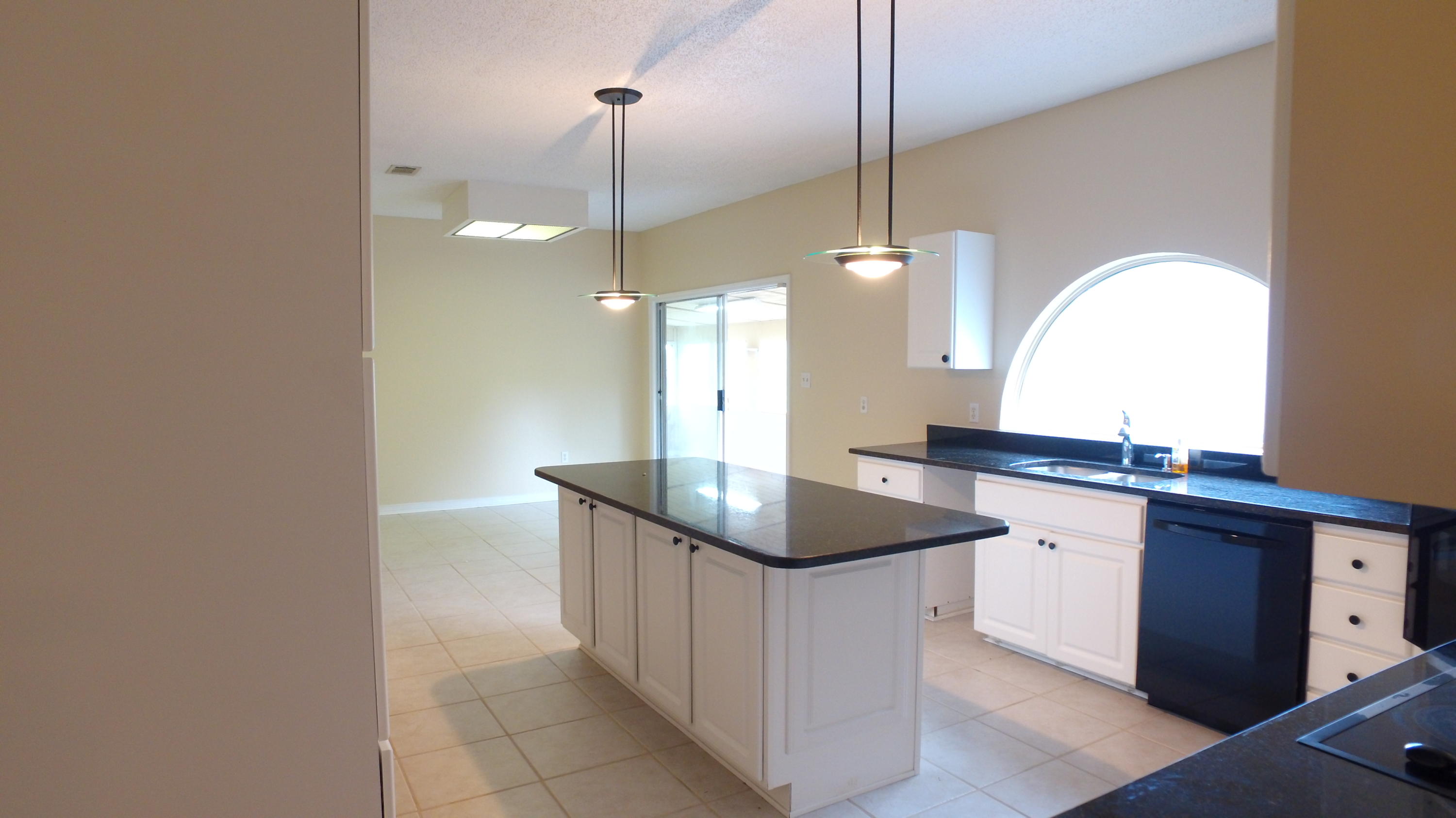 564 Ridge Lake Road Crestview, FL 32536 - Photo 35 of 58 a kitchen with granite countertop a sink a counter top space and cabinets