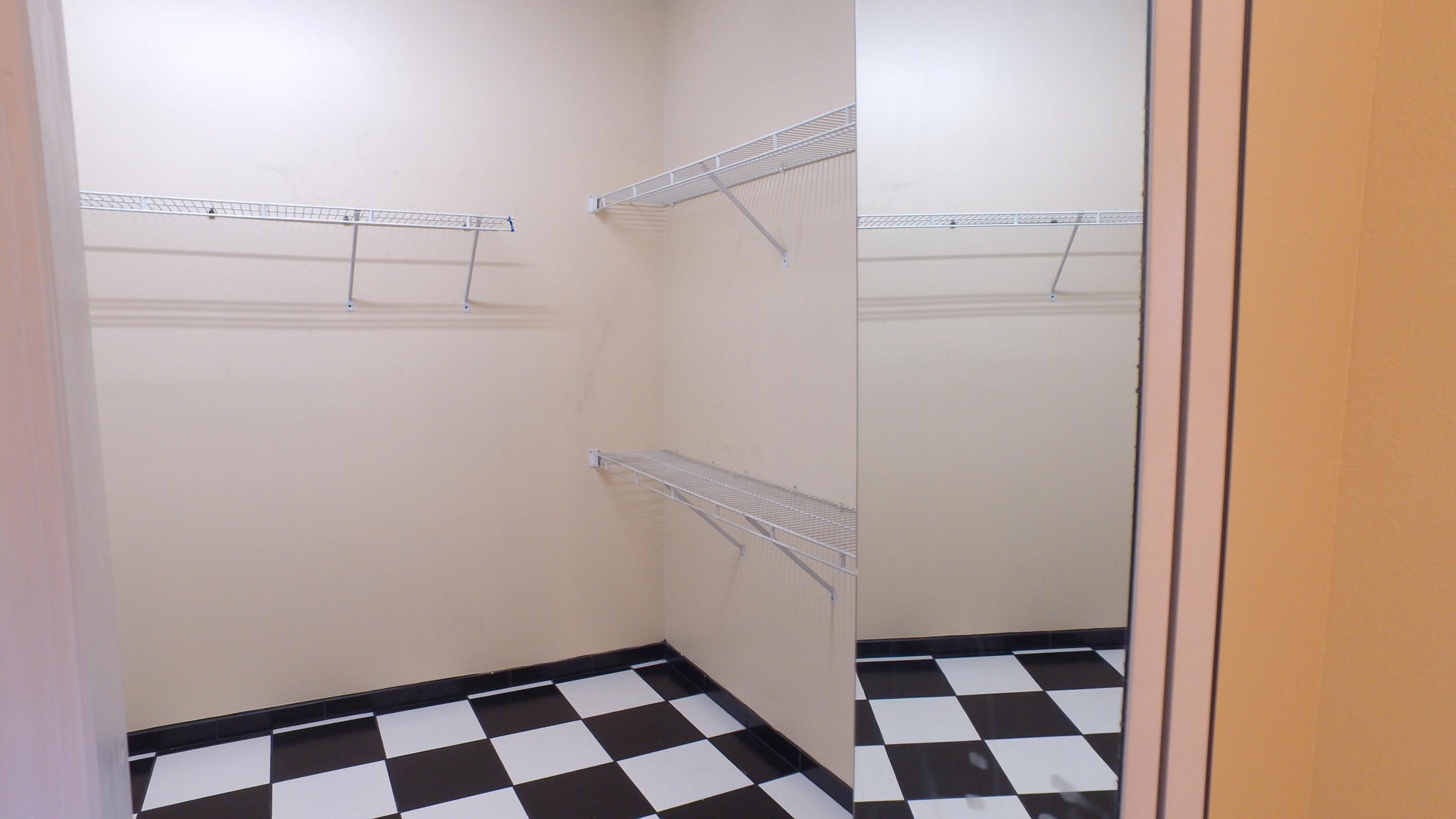 564 Ridge Lake Road Crestview, FL 32536 - Photo 48 of 58 a room with a walk in closet and a window