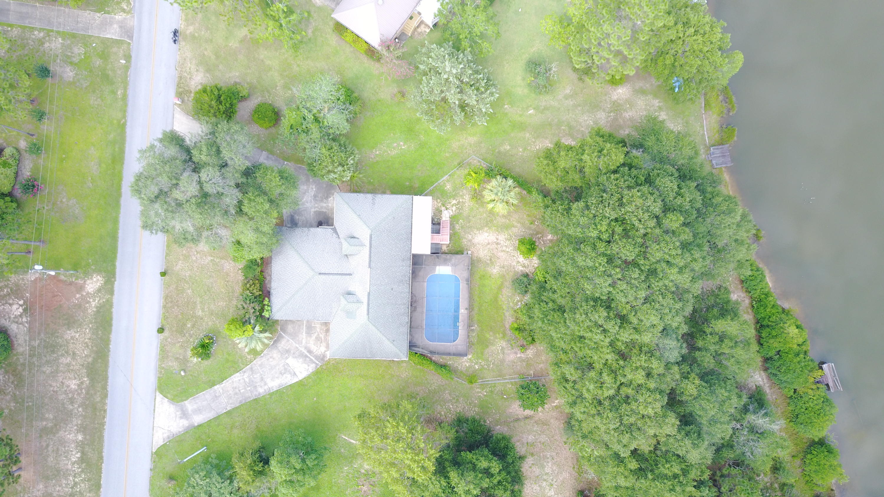 564 Ridge Lake Road Crestview, FL 32536 - Photo 5 of 58 a backyard of a house with outdoor seating and green space