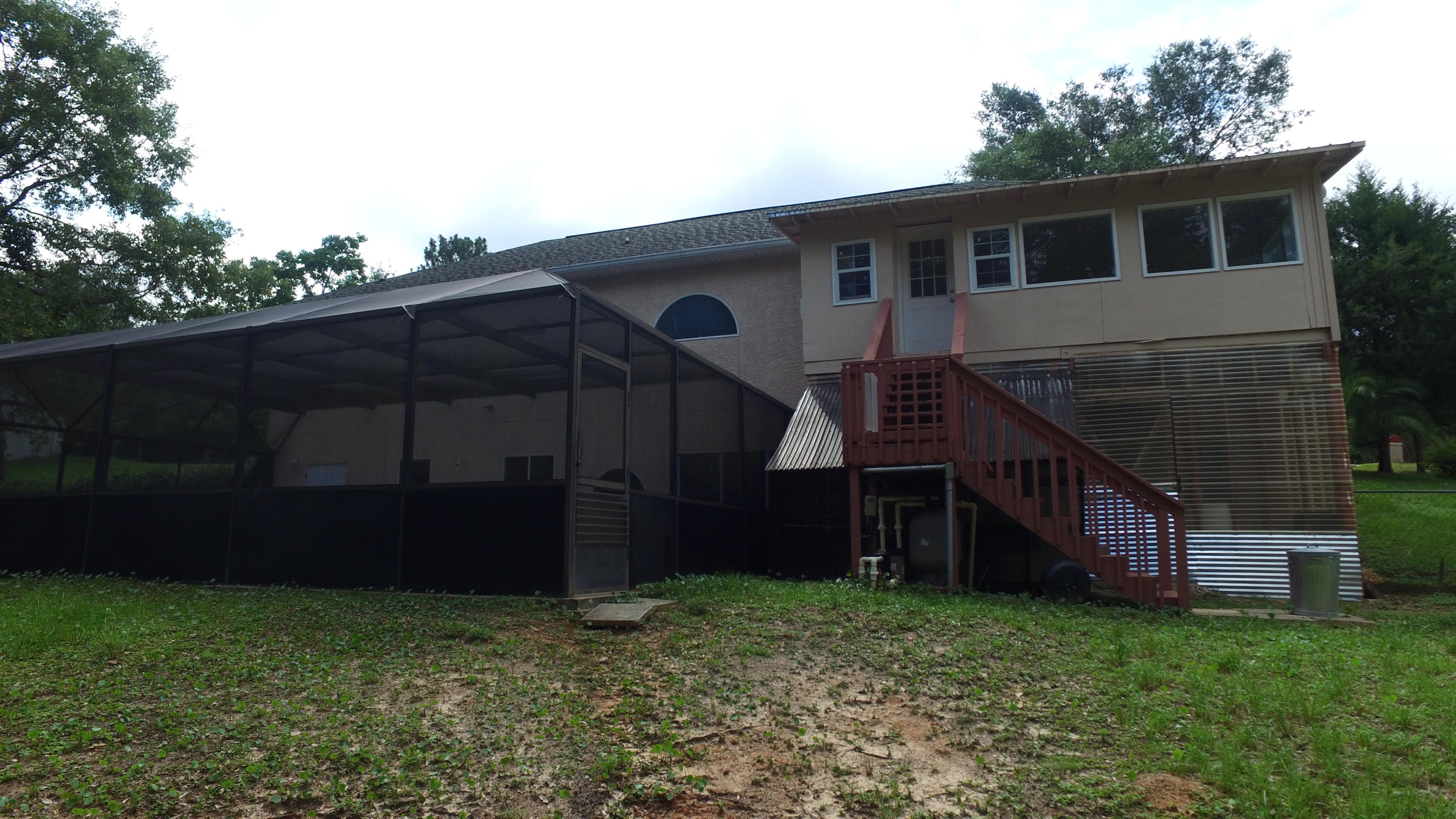 564 Ridge Lake Road Crestview, FL 32536 - Photo 52 of 58 a view of backyard of house and wooden deck