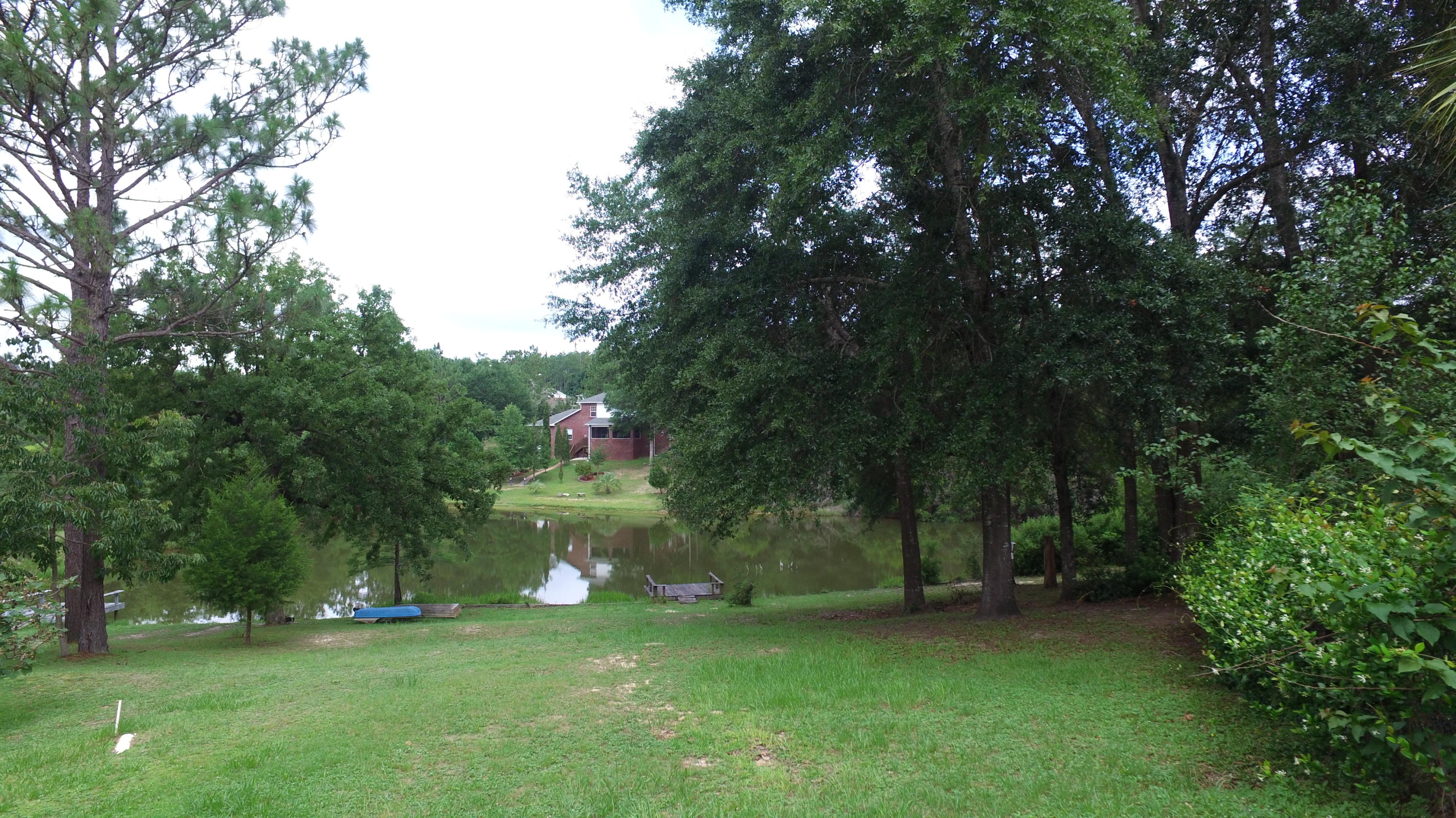 564 Ridge Lake Road Crestview, FL 32536 - Photo 55 of 58 a big yard with lots of green space and trees