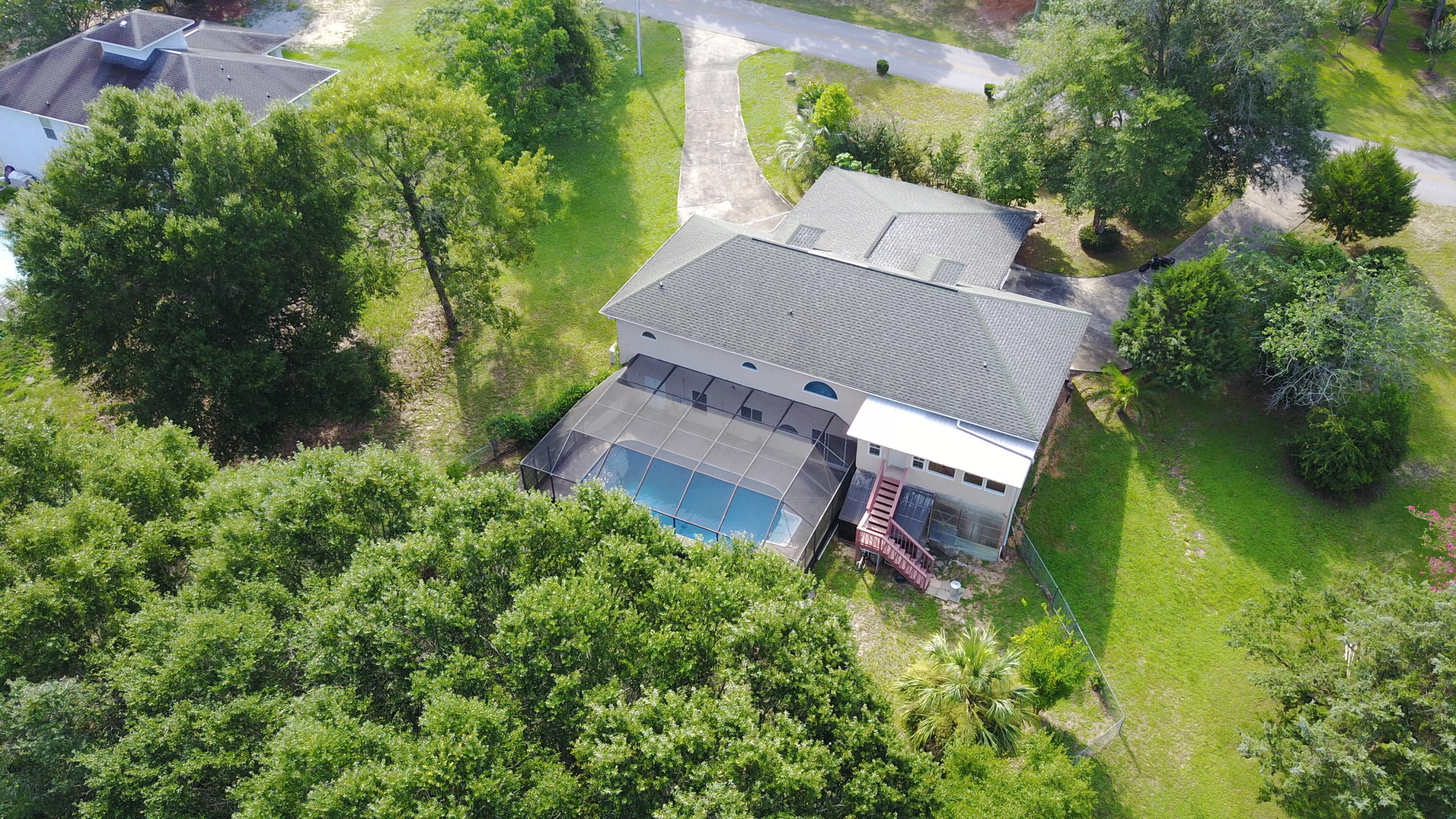 564 Ridge Lake Road Crestview, FL 32536 - Photo 6 of 58 an aerial view of a house with a yard and tree s