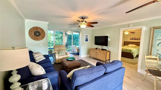a dining room with wooden floor and a glass door