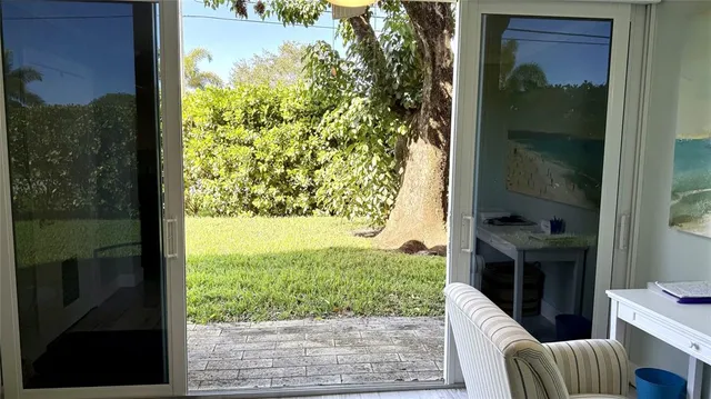 a view of a porch with furniture and yard