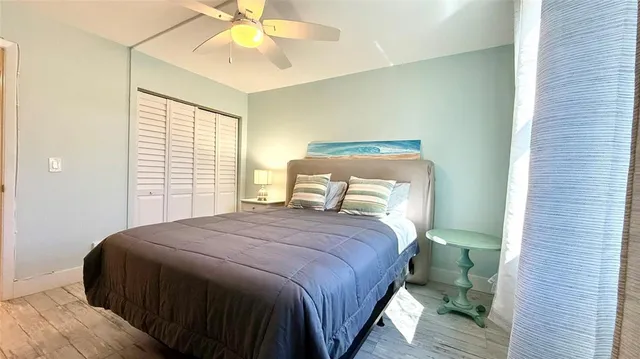 a bathroom with a sink a toilet a mirror and shower